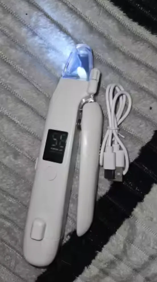 Customer photo of the LED Dog Nail Trimmer with cable on a gray blanket