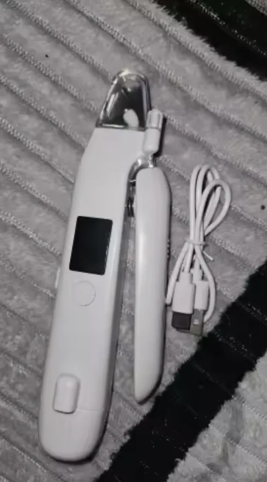 Customer photo of the LED Dog Nail Trimmer on a gray blanket