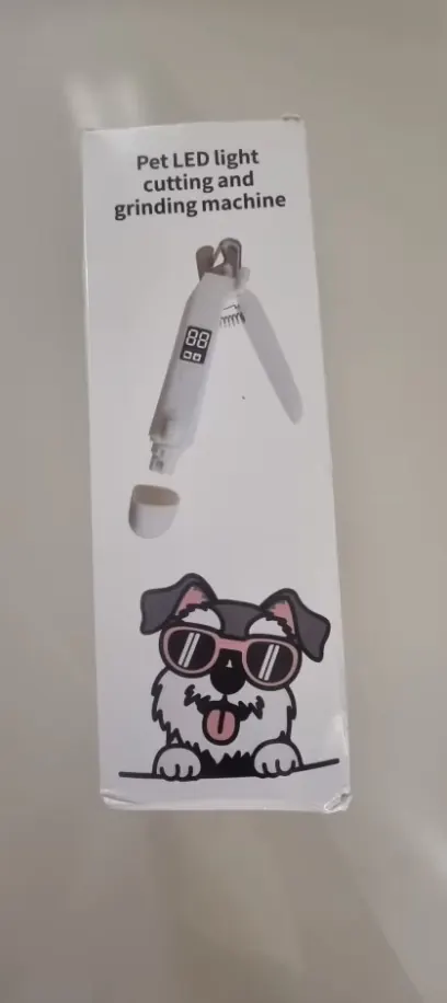 Customer close-up photo of the LED Dog Nail Trimmer in hand